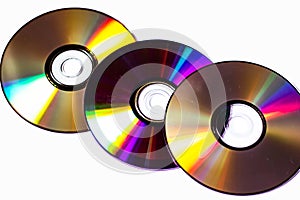 Technological background created with the photo of cd, the light accentuates the reflections coloring them.