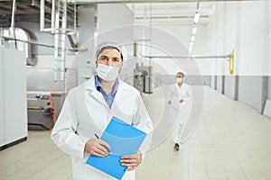 Technologist man at food factory . photo