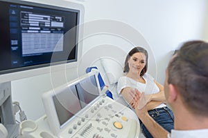 Technologist and patient on conversation