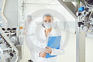 Technologist woman at food factory . photo