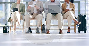 Technology, airport waiting room and legs of business people reading plane schedule, flight booking or transport journey