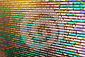 Technology background. Hacker breaching net security. Source code close-up.