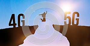 Technology change from 4G LTE to 5G, global wireless network. Silhouette man jumping from cliff to cliff on sky