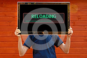 Reloading - Message on the monitor  technology conquers our heads photo