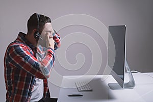 Technology, gaming, entertainment, let`s play and people concept - young man in headset and glasses with pc computer playing game