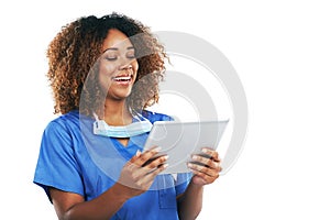 Technology has become such a vital for her. Studio shot of an attractive young nurse using a digital tablet against a