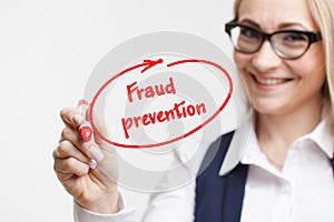 Technology, internet, business and marketing. Young business woman writing word: fraud prevention photo