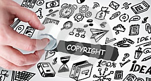 Technology, Internet and network concept. Young businessman shows the word: Copyright