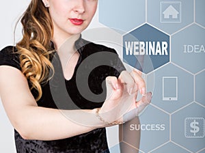 Technology, internet and networking concept. beautiful woman in a black business shirt. woman presses webinar button on