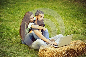 Technology, nature, pretty girl hugging frown, bearded man using computer