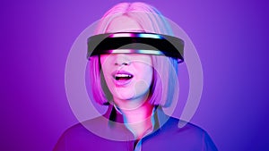 technology, online game, entertainment, virtual world in 3D simulation. millennial woman in vr glasses plays in the neon