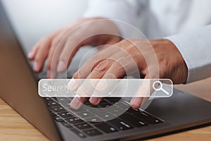Technology search engine optimization SEO. Man hands are using a computer notebook to searching for data information.