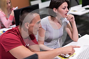 Technology students group working in computer lab school class