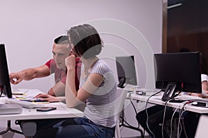 Technology students group working in computer lab school class