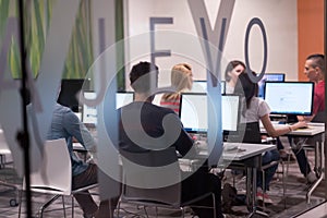 Technology students group working in computer lab school class