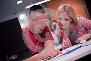 Technology students group working in computer lab school class