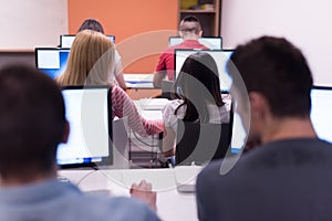 Technology students group working in computer lab school class