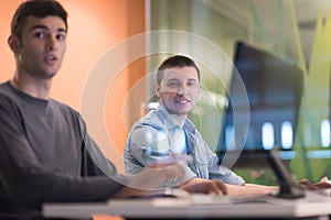 Technology students group working in computer lab school class