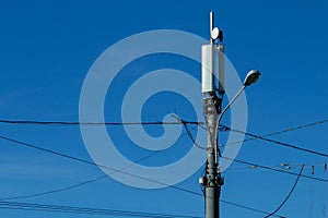 Technology on the top of the telecommunication 4G,LTE GSM tower antenna, transmitter, blue sky.