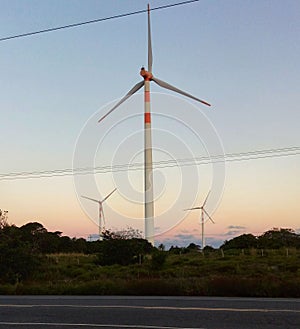 Technology wind energy sunset and road