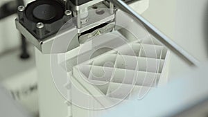 Technology. The work of a three-dimensional printer. 3D printer during printing close-up. Process of working 3D printer.