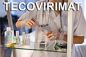 Tecovirimat. Nurse. Medical. Text written on an unfocused background and virus design of a nurse with an injection photo