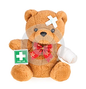 Teddy bear with bandage isolated on white