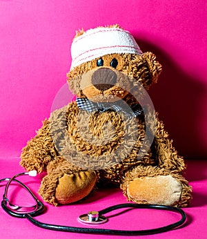 Teddy bear with bandage and stethoscope for child medical education