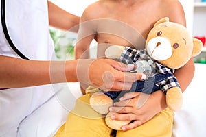 Teddy bear being checked for a heartbeat