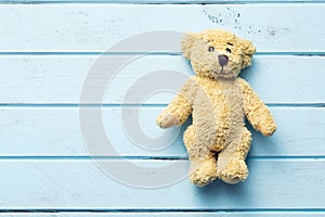 Teddy bear on blue table