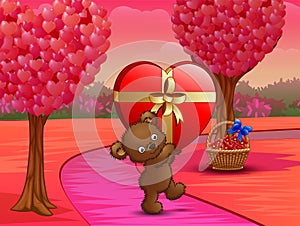 Teddy bear carrying big gift of red heart in pink field