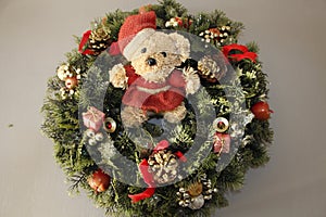 Teddy bear on a Christmas wreath