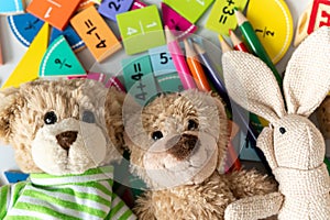 teddy bear close up with pencils, fractions, blocks on the table. activities for kids. preschool