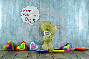 Teddy Bear and colourful hearts and words Â«Happy Valentines Day