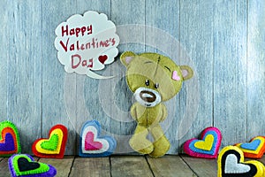 Teddy Bear and colourful hearts and words Â«Happy Valentines Day