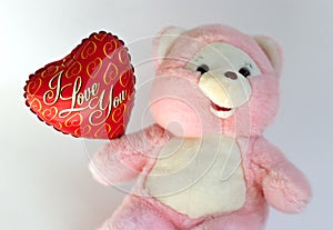 Teddy bear with heart balloon