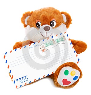 Teddy bear holding envelope