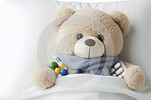 Teddy bear laying in bed and feeling sick isolated on solid white background. ai generative