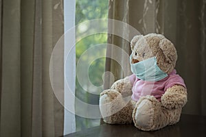 Teddy bear with medial mask on its face