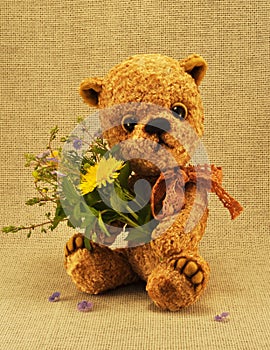 Teddy-bear Misha with flowers