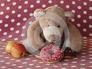 Teddy bear prefers doughnuts to apples