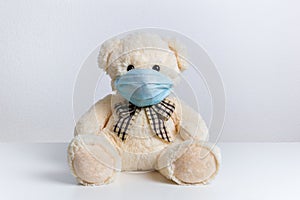 Teddy bear with protective medical mask on his face. Concept of hygiene and virus protection for child patient