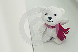 Teddy bear with red bow decoration