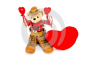 Teddy bear and red hearts on a white background