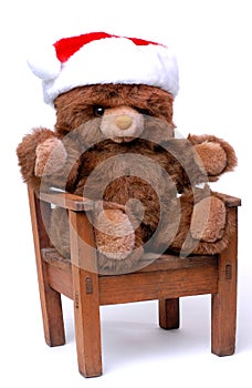 Teddy Bear With Santa Hat in Chair