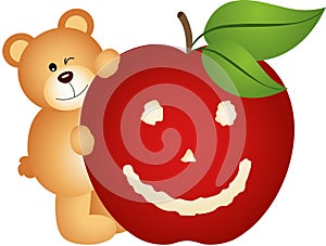 Teddy bear with smiling apple