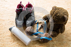 Teddy bear with sneakers, Dumbbells and tape,Sport equipment