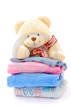 Teddy bear stack of kids clothes