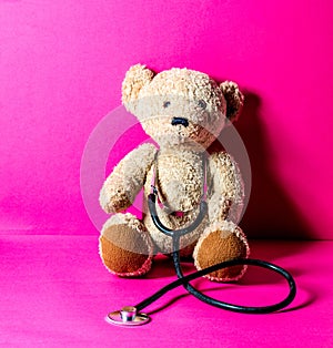 Teddy bear with stethoscope for checking an injury after mishap