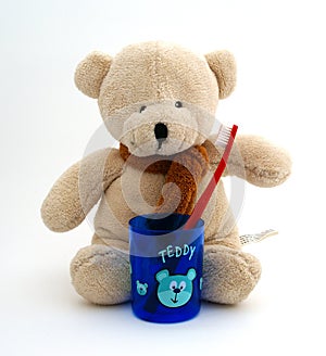 Teddy bear with toothbrush